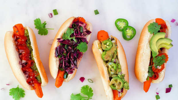 Carrot hot dogs with various veggie toppings.